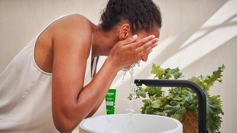 woman cleaning face